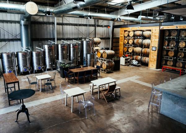 Tasting room and tanks at The Austin Winery