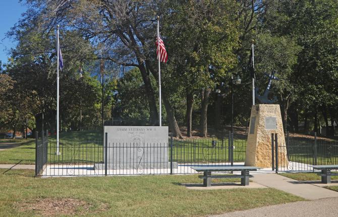 The US Merchant Marine & US Navy Armed Guard Memorials sit inside a fenced-in area at Veterans Memorial Park in Wichita