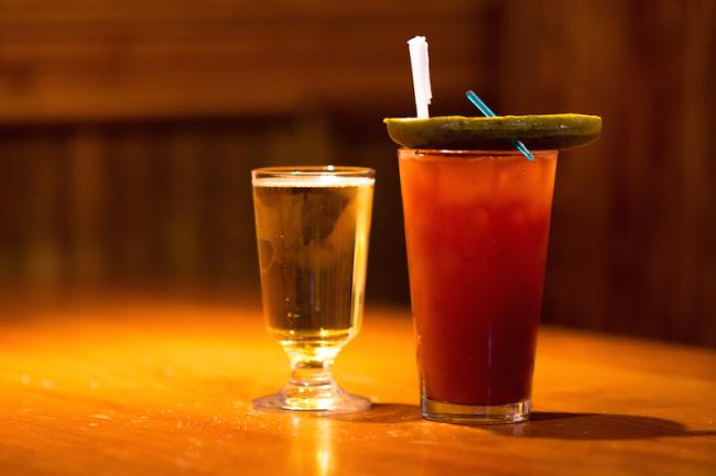 Bloody Mary topped with a pickle with a side shot of beer at Amber Inn in Eau Claire