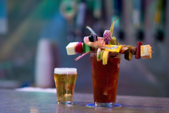 Bloody Mary topped with cheese, olives, Laffy Taffy with a side of beer at Big T's Saloon in Eau Claire