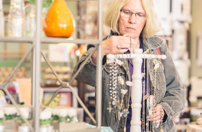 A patron looking at a necklace in Botetourt County Jewelry store.