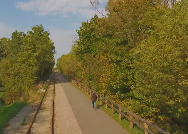 woman riding along whistlestop trail