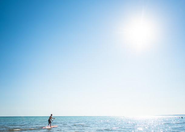 Man Paddleboarding in Port Stanley