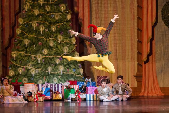 Dancer performing a leap in the Nutcracker by the Rochester City Ballet