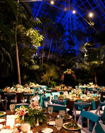 Franklin Park Conservatory Palm House at night filled with dining tables