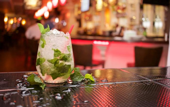 Mojito Glass on Bar at a Houston Happy Hour