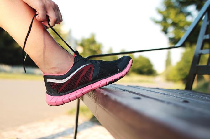 A runner ties her new running shoes before a race in Wichita