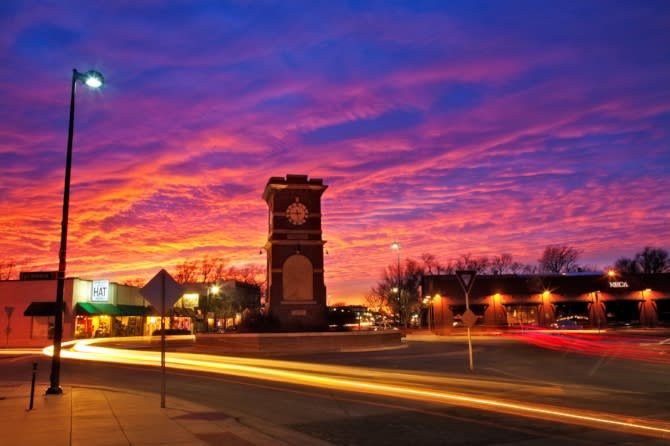 Historic Delano District in Wichita KS at Sunset with pink, orange and purple sky courtesy Mickey Shannon