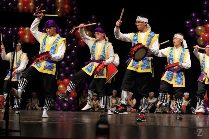 Performers play drums during cultural dance at wichita asian festival in wichita ks