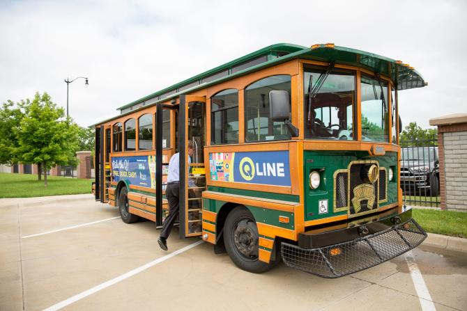 A man boards the Q-Line - a free trolley in Wichita that navigates through downtown
