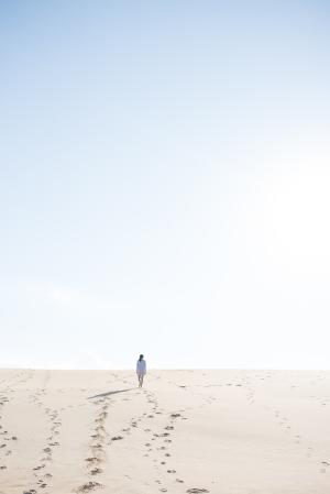 A woman enjoys the wide open spaces of Jockey's Ridge State Park in North Carolina.