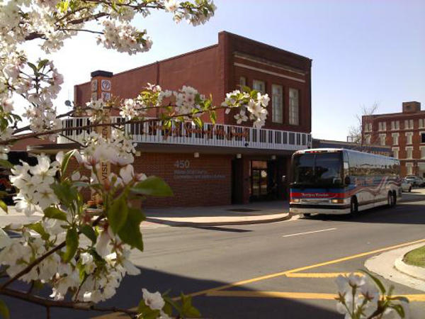 Downtown Visitor Center in Macon, GA with cherry blossoms in the foreground