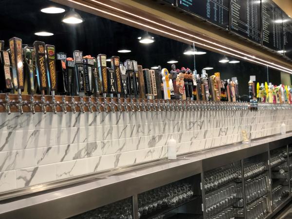 Bar at Growler USA with 102 beers