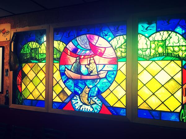 This stained glass window depicting two fishermen in a boat is the focal point at Briali Vineyards & Winery in Fremont.
