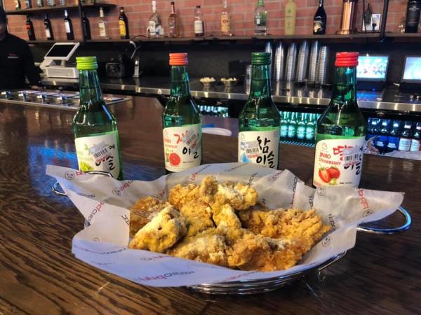 basket of chicken wings and sodas