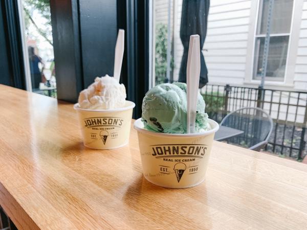Two Johnson's Ice Cream cups filled with color scoops of ice cream