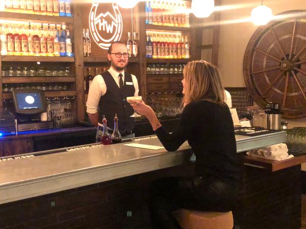 Writer Locke Hughes chats with bartender