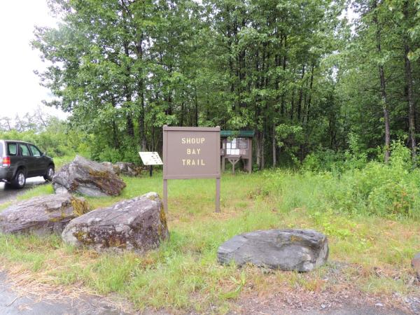 A wooden sign for a hiking trail