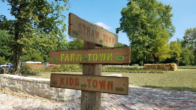 Navigate the straw maze in Straw Town during the Old Town Waverly Park Festival