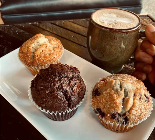 A warm cup of coffee with three different muffin flavors from Third Perk Coffeehouse in downtown Dayton.