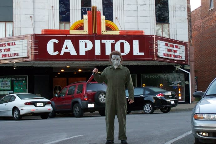 Person dressed as Michael Myers in front of the Capitol Theater in Bowling Green