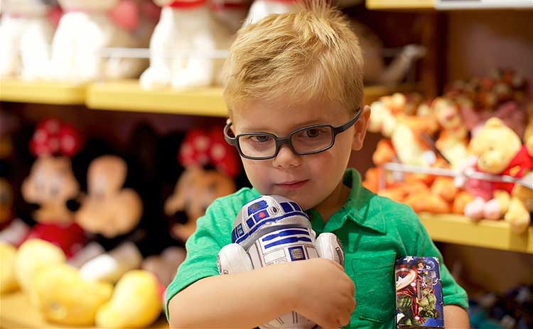 Christmas Shopping Boy holds toy R2D2 at The Disney Store in The Overland Park Oak Park Mall