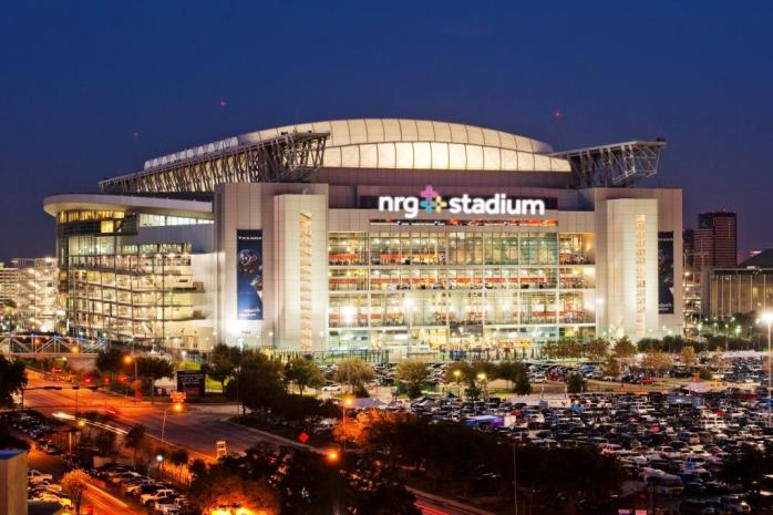 Night view of the NRG Stadium in Houston, Teax lit up for an event.