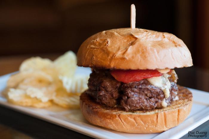 Savor a gourmet burger on the patio at Bacchus Bar & Bistro.