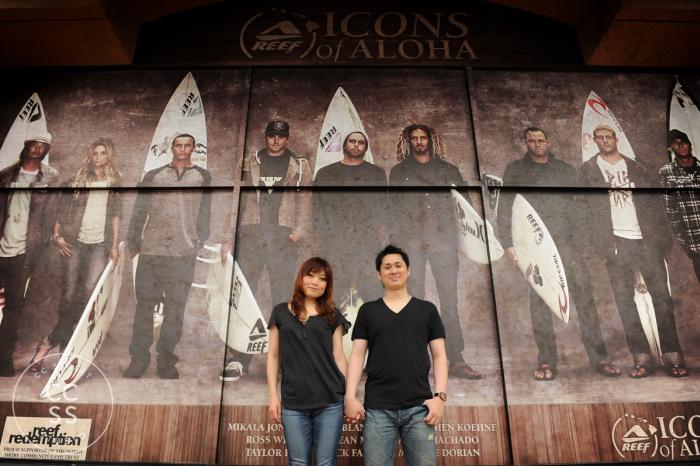 Downtown HB is a great place for photos with an edgy or urban feel. Here a couple is photographed in front of a photo mural adorning one of the Main Street surf shops. Photo courtesy of Carly Street