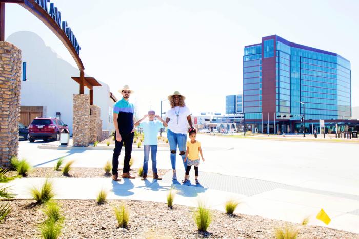 Family In Front Of The Texican Court In Irving, TX