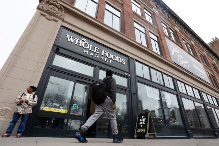 People Walking Past Whole Foods Market In Newark, NJ