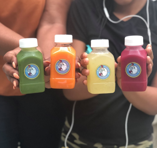 People hold up a selection of tiny but powerful flavors from Juicing Jammer in Dayton.