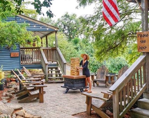 Rachel Holtin on wooded patio