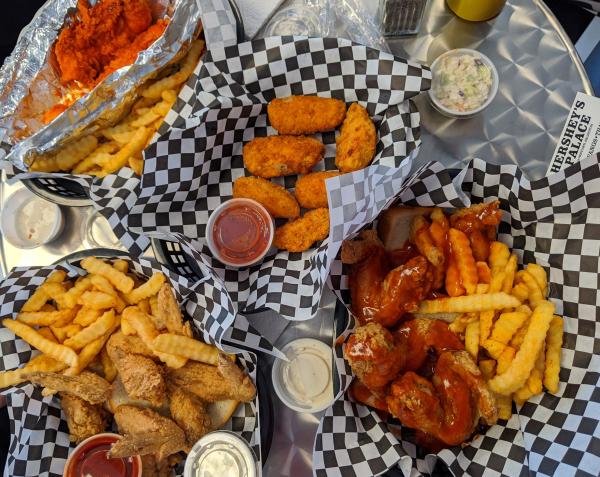 Photo of baskets of food with chicken wings and french fries
