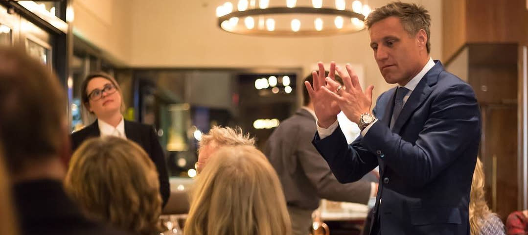 Man Speaking to group at the Frasca Food and Wine