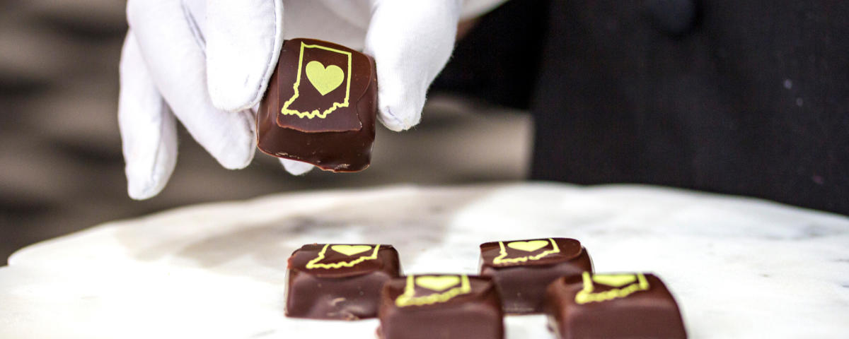 A chocolate with the outline of Indiana and a heart from XChocol'Art in Carmel, IN