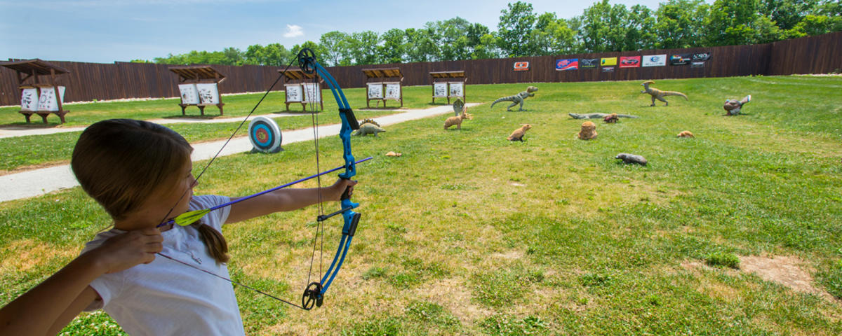 Kid Shooting A Bow At Strawtown Koteewi Park In Hamilton County, IN