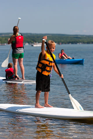Young boy paddleboarding