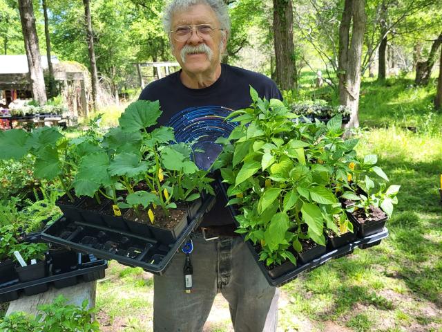 Man holding plants