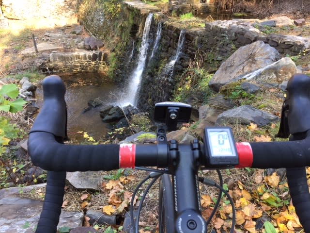 Biking in the fall by a waterfall