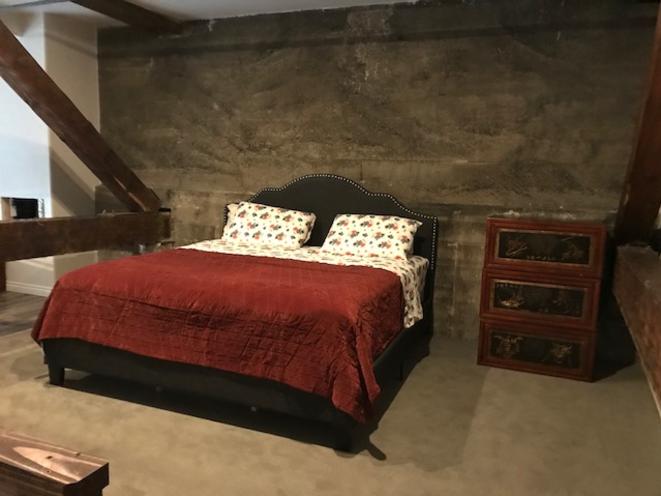 King size bed in loft apartment 303
