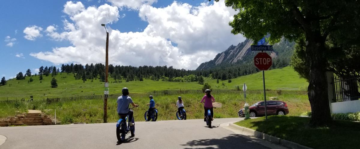 Group riding e-bikes on Boulder streets