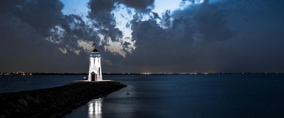 Lake Hefner Lighthouse lit up at night