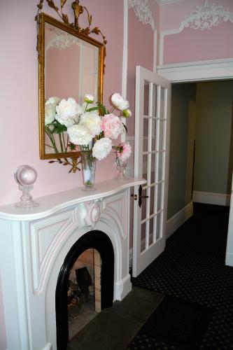 Saratoga Arms pink and white dining room fireplace