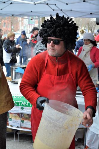 Guy serving with Fro wig