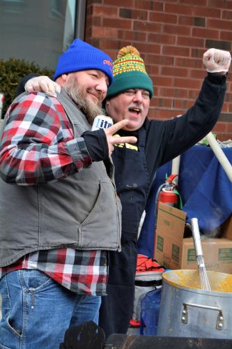Two guys cheering at City Center