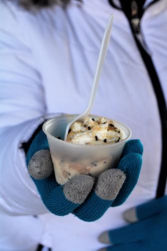 Gloved hand holding chowder