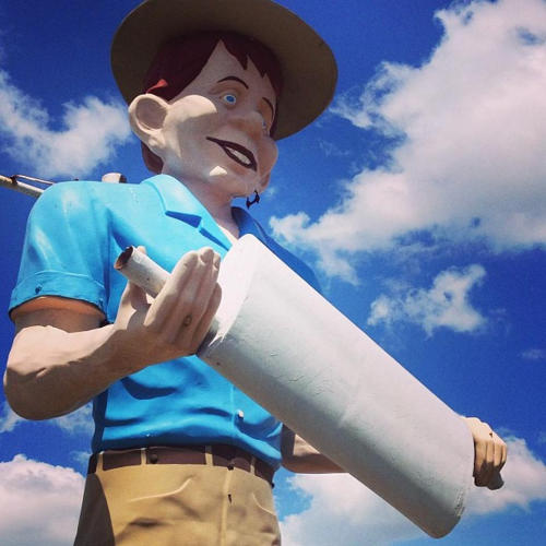 Happy Half-Wit Muffler Man stands against the sky in Beaumont, TX