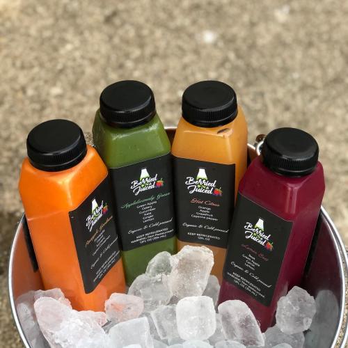 A collection of fresh-pressed organic juice flavors from Berried and Juiced.