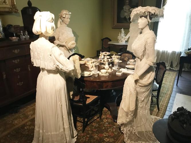 Walworth Mansion exhibit with three women standing in dining room